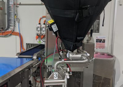 Custom heater jacket for hopper on a Unifiller machine in cake production