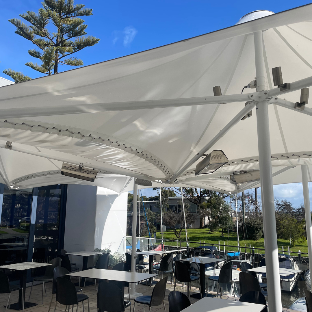 Short wave infrared heaters mounted on umbrellas give localised comfort at restaurant tables